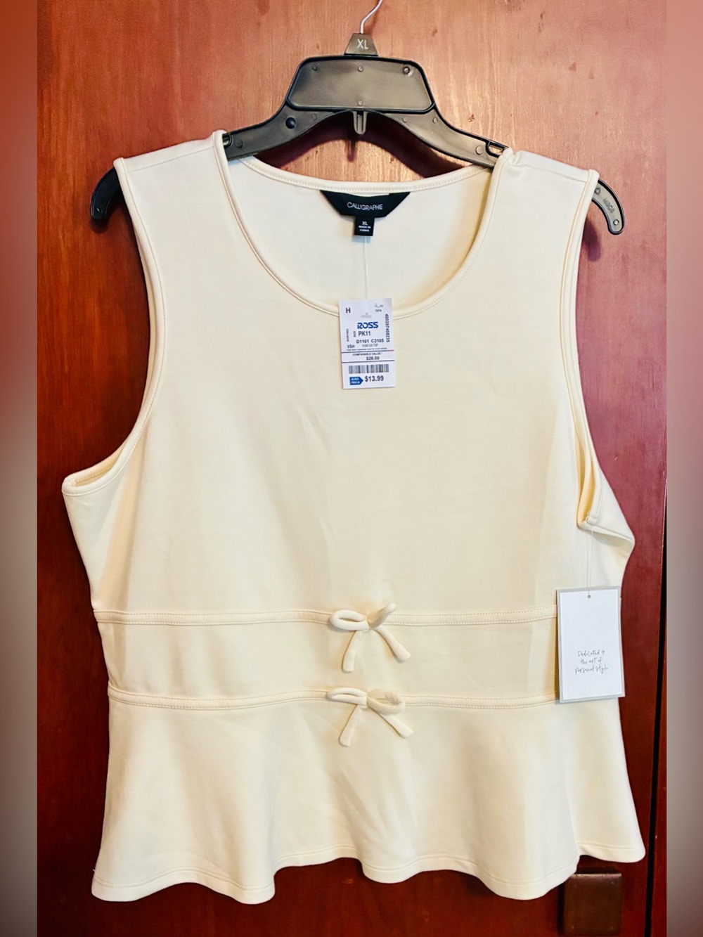 Caligraphie Sleeveless Peplum Top in Pale Yellow